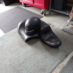 Old Motorcycle Seats And Helmet