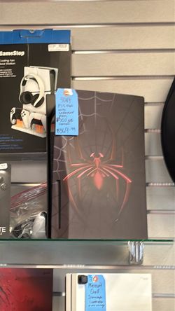 Sony PS5  disc edition with black plates and Spider-Man decal