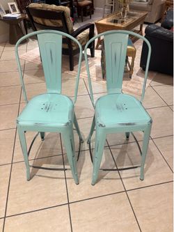 Set of TWO Distressed Teal Metal Counter Height Stools with Vertical Slat Back and Drain Hole Seat