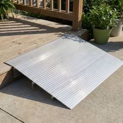 Portable step ramp for wheelchair