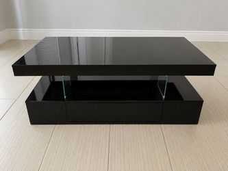 Modern High Gloss Black Coffee Table with Glass Supports