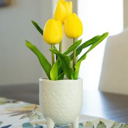 Real-touch artificial tulips floral arrangement in pot flowers. 13” H x 4.5” W x 4.5” D. Pot material: ceramic. MSRP: $51. Our price: $22 + Sales tax