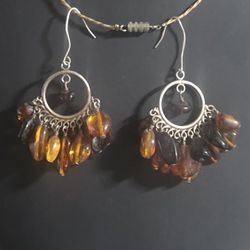 Bohemian-style chandelier earrings featuring what looks like Baltic Amber or high-quality amber-toned resin beads.