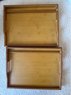 2 tv trays fold out with a phone holder