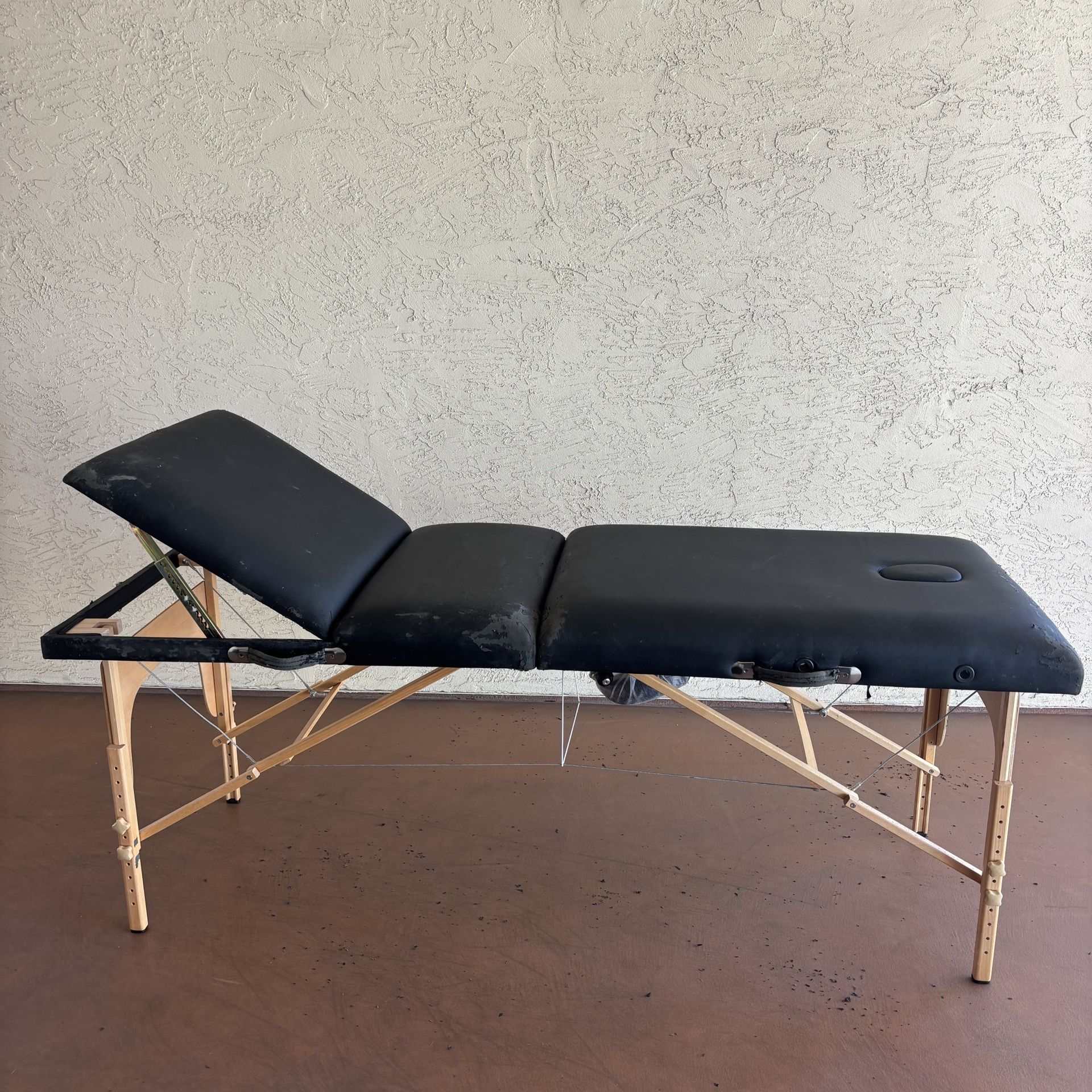 One Black Massage Table With accessories and Black Carrying Case