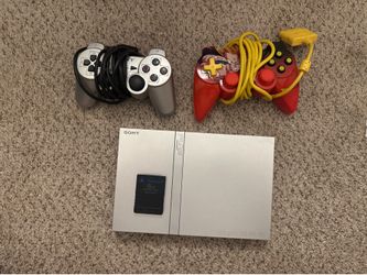 PlayStation 2 with two controllers/ games/ 8MB memory card