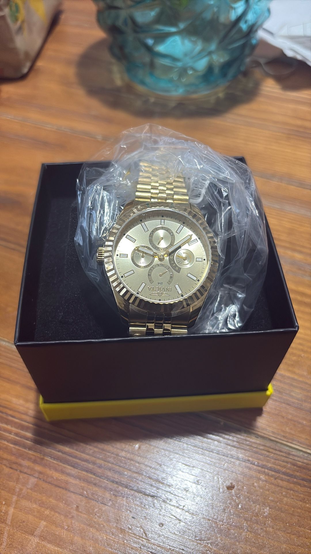 Gold Invicta watch