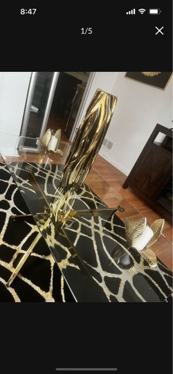 Three piece glass, gold, coffee table, and end tables