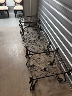 Beautiful vintage wrought iron living room table set featuring ornate scrollwork