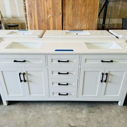 Brand new bathroom vanity in White “72" double sink, soft close and solid wood. 6 Drawers, 4 doors with electrical outlets and Marble top in white