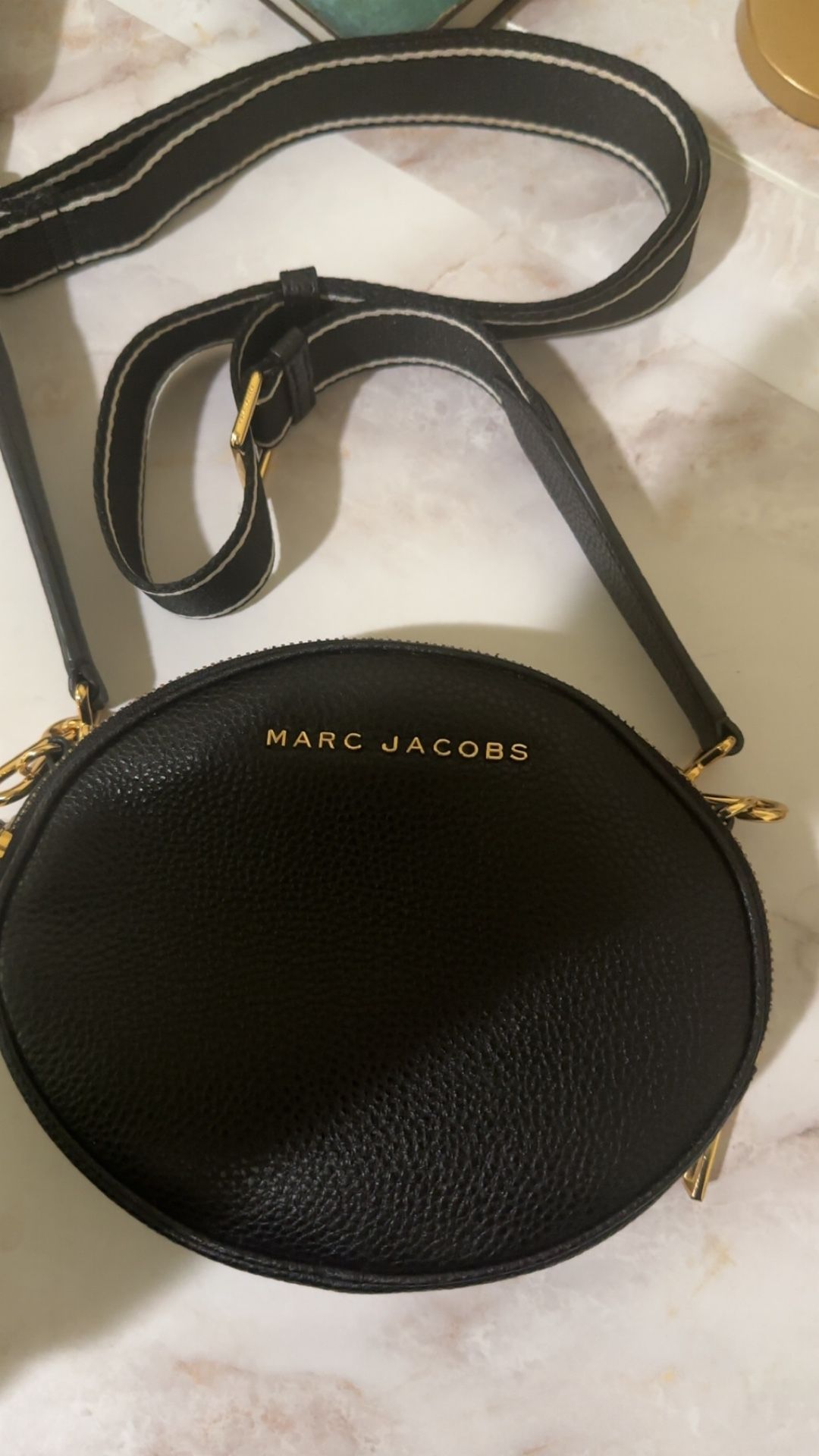 Black leather Marc jacobs purse with double zippers.