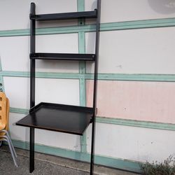 Black leaning wall desk