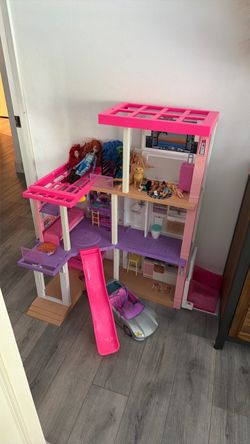 Barbie dream house with dolls and accessories