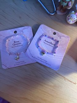 2 bracelets purple and pink