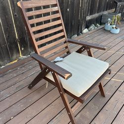 Four wooden outdoor chairs