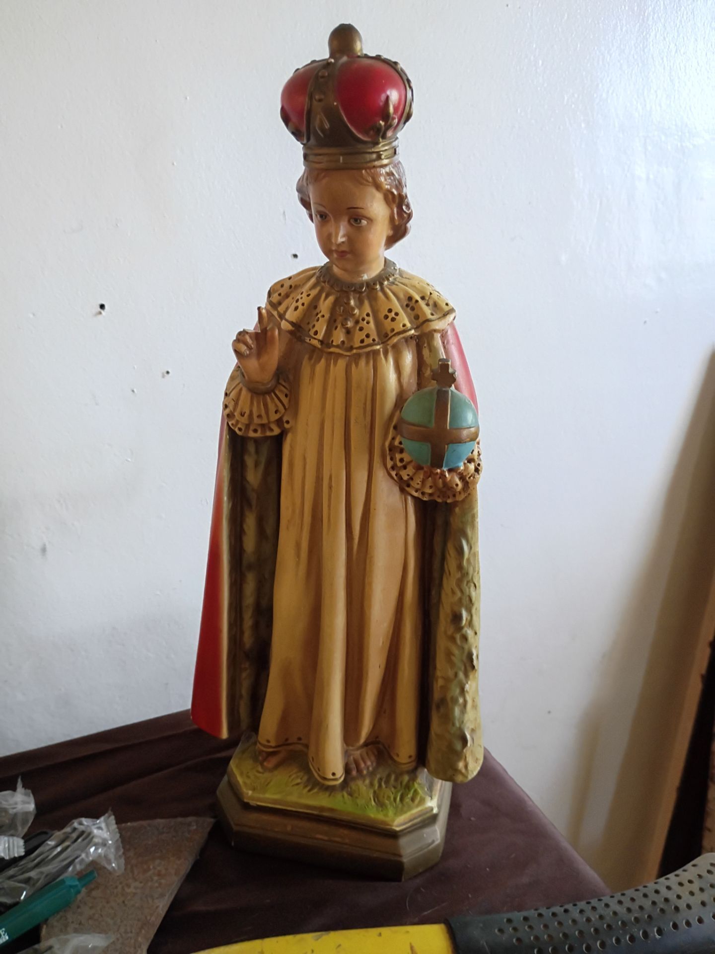 This is a vintage chalkware or plaster statue of the Infant Jesus of Prague.