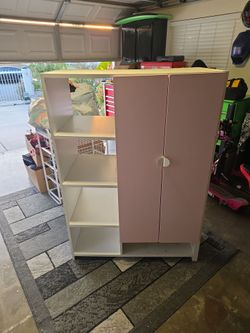 Girls stand-alone closet with shelves