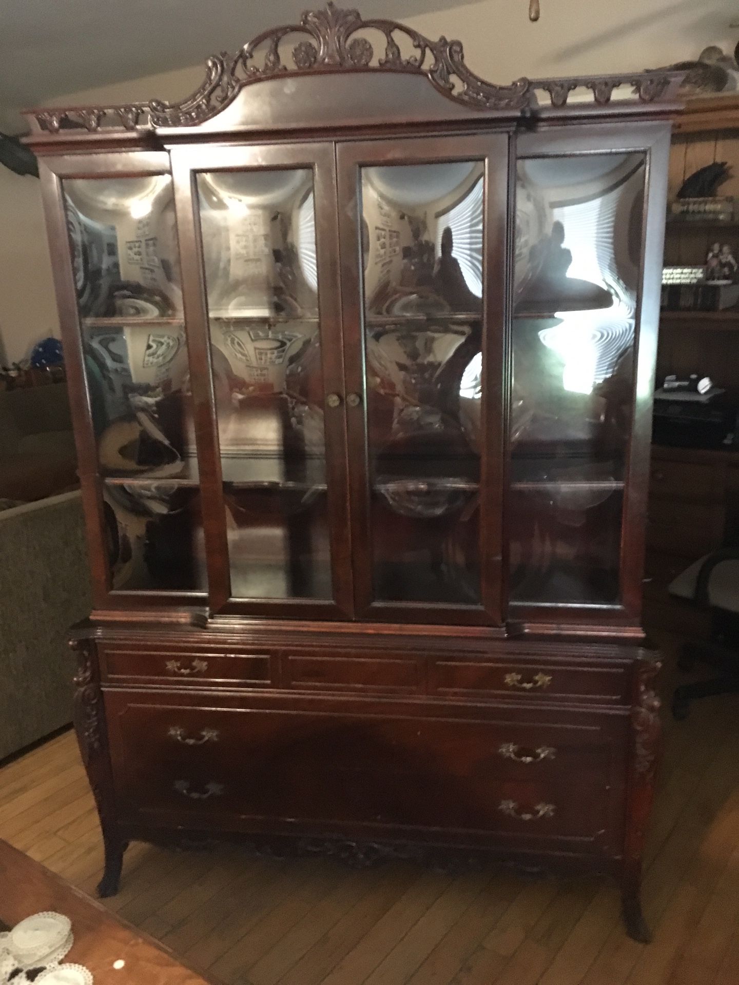 Antique cabinet cherrywood and beautiful bowed glass asking 600 from my grandma probably 1920’s