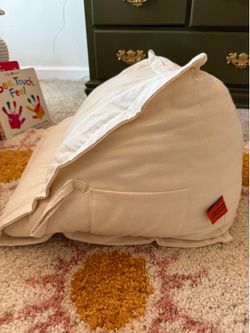 Peekaboo Pillow official tummy time pillow