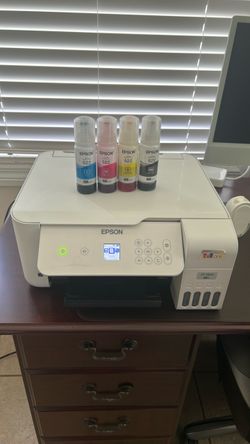 Epson printer with with ink refill incluid.