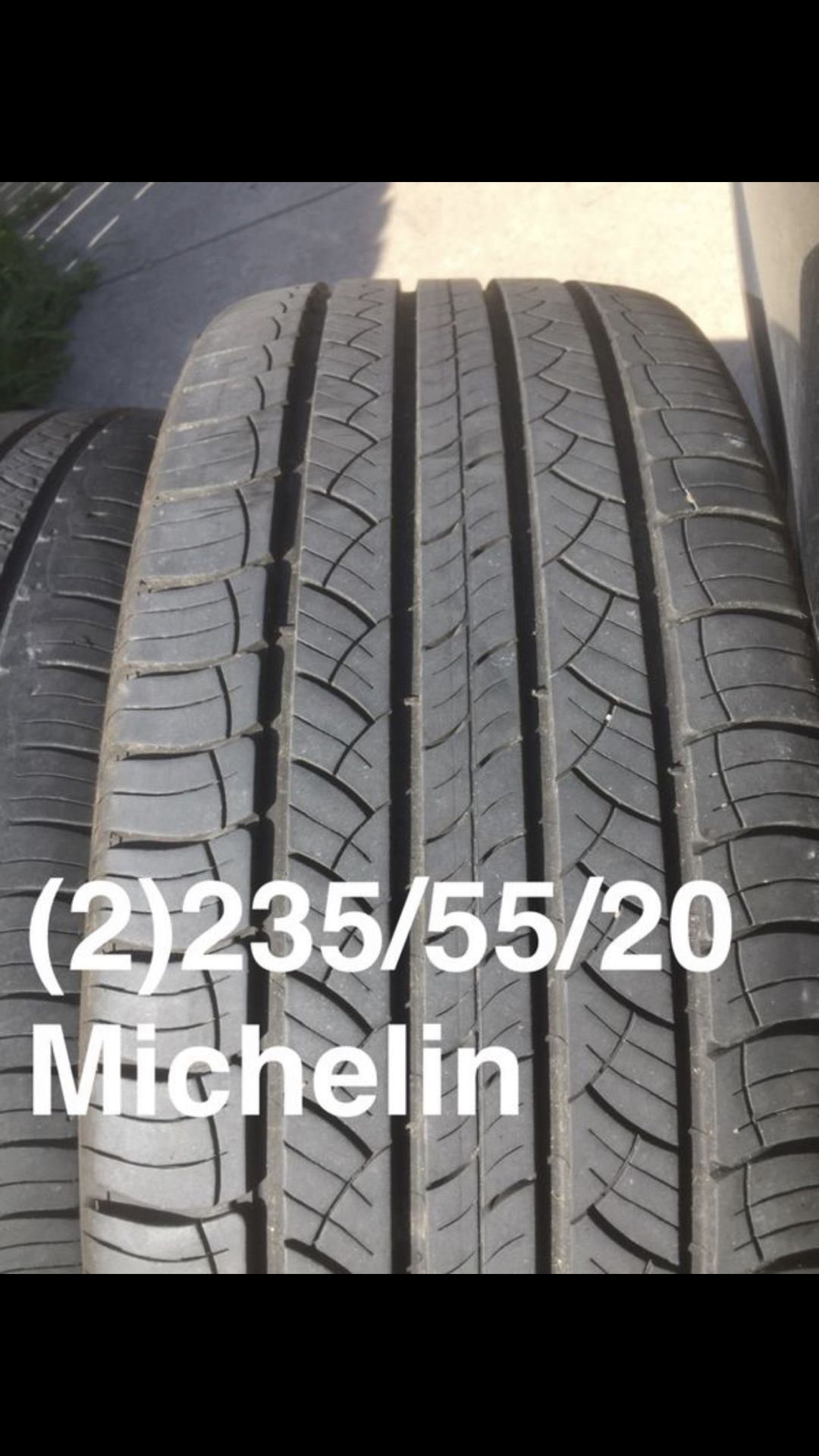 Two 235/55/20 Michelin Latitude Tour Hp one at 80% one at 60%