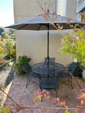 Restoration Hardware Classic Black Iron Table, chairs, & lounger. Includes umbrella and Stand.