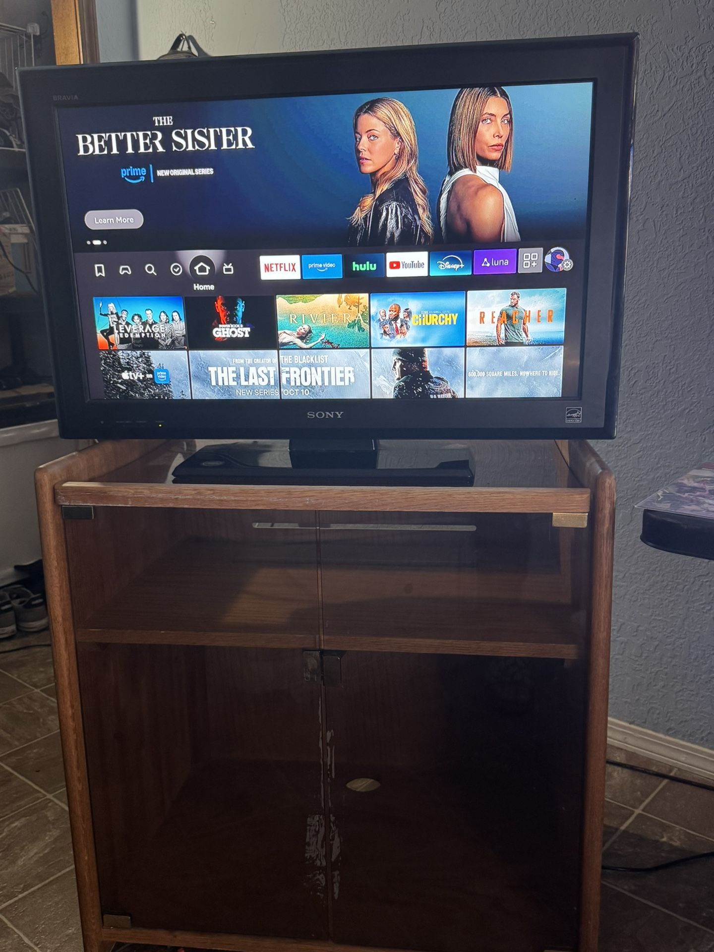 32” Sony TV With Glass Entertainment Center (+$10 For Amazon FireStick)