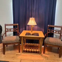 Set of two chairs, table, and lamp