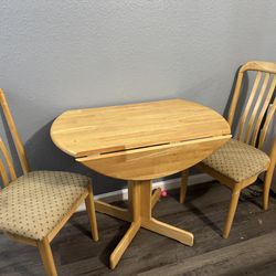 Double drop leaf table and two chairs