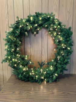 Very large lighted Christmas wreath folds for easy storage