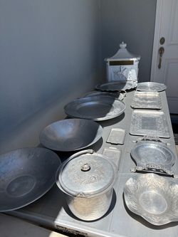 Collection of vintage hammered aluminum serving dishes, platters, trays, etc.