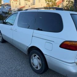 6-cylinder | 272K miles | White exterior, tan leather interior