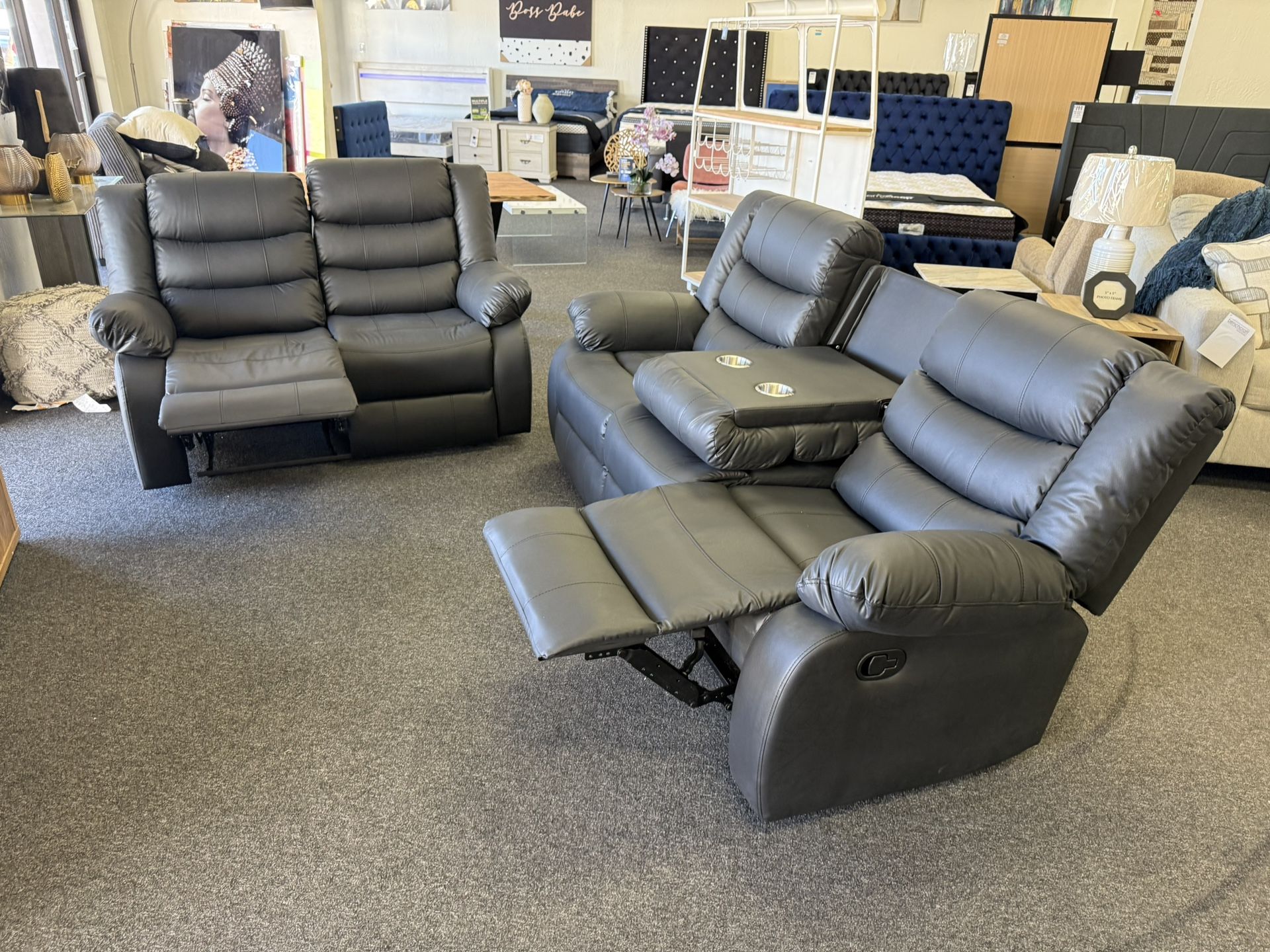 Reclining Sofa And Loveseat In Black Leather