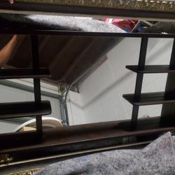 Antique mirror with shelves.  