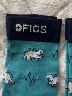 FIGS compression socks, size medium dinosaur logo brand new will sell separately or as a pair