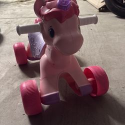 Baby girl riding unicorn