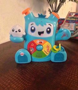 Fisher-Price Dance & Groove Rockit interactive musical toy with Smart Stages learning content for babies and toddlers.