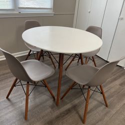 A Table And 4 Chairs 