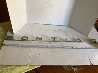 Chrome plated Pontiac emblem 1960s or 70s rear trunk nameplate approximately 19.5” long