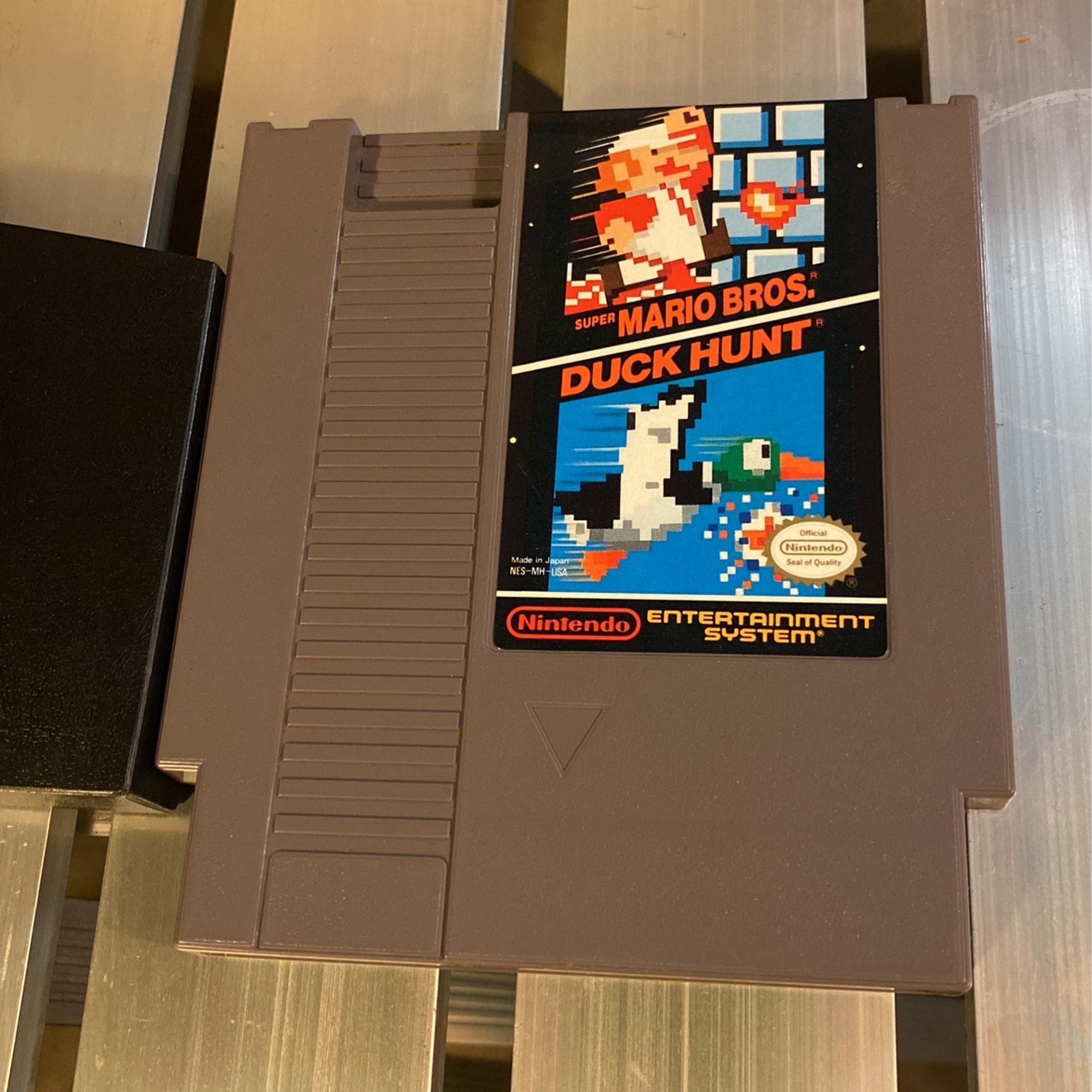 Super Mario Bros / duck hunt With Protective Sleeve.  