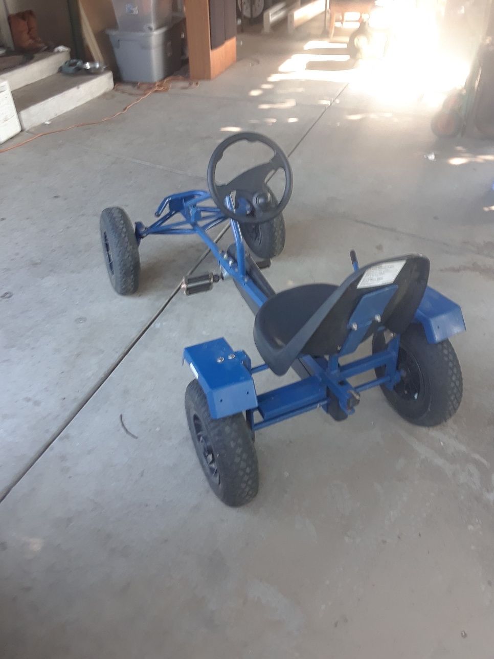 Adult pedal car.