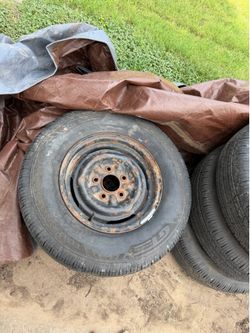 Set of 4 new 14” tires vintage rims 65 Chevy