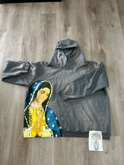 Heaven Sent Hoodie with a painted Virgin Mary graphic.