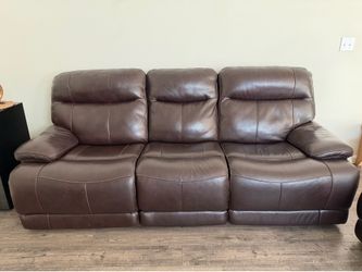 Leather power reclining sofa