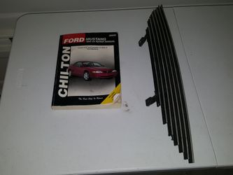 Ford Mustang repair book and billet grill