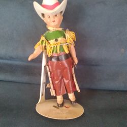 7-inches tall vintage cowgirl doll with a removable hat