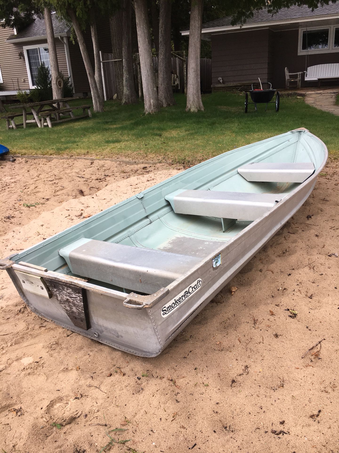 Photo 12 foot Smoker craft row boat. Rated 7.5 outboard