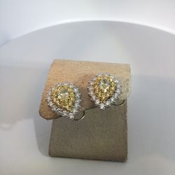 Ladies, The Stone, 18 Karat Study Earrings With 21.00TWFear Diamond With 24 0.72Tw Round Diamonds And 1.6 two Other Stones 