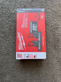 2 Milwaukee Battery 5 Ah M12 + Charger (Brand New, Sealed in box)