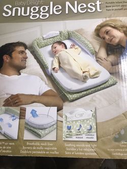 Snuggle nest portable infant sleeper 0-4 months